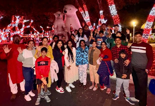 The fellowship out together among Christmas lights