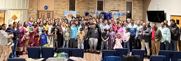 The congregation standing together during a service