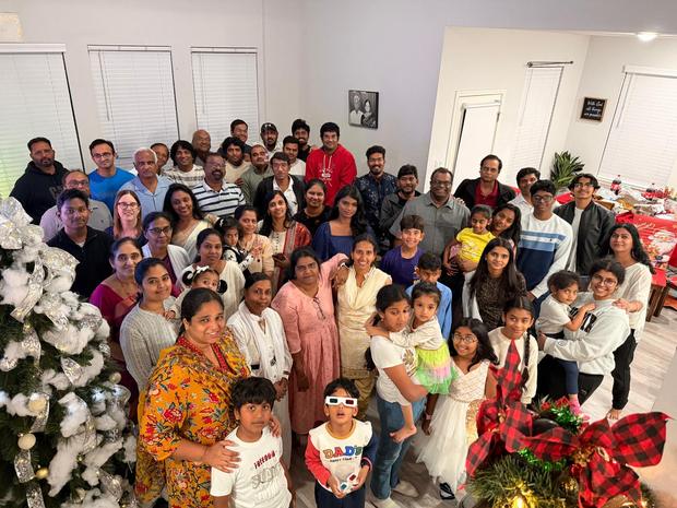 Families beside the Christmas tree