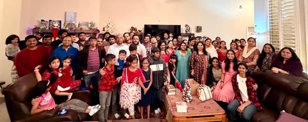 The fellowship together in a home with gifts to share