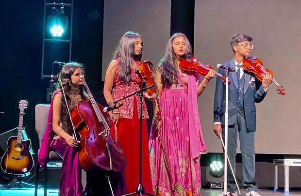 Musicians playing violins and cello during a service