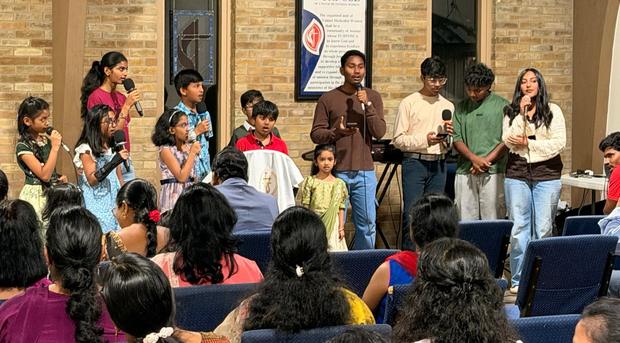 Families and children at an indoor gathering