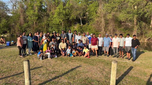 The fellowship together outdoors at a park