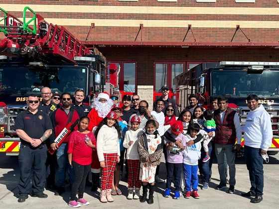 Fellowship families visiting the local fire station at Christmas